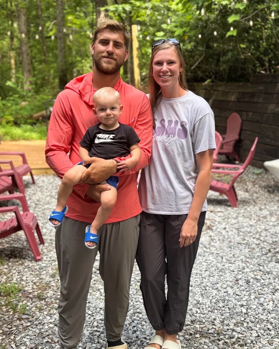 Daniel Fuller with his wife and young son